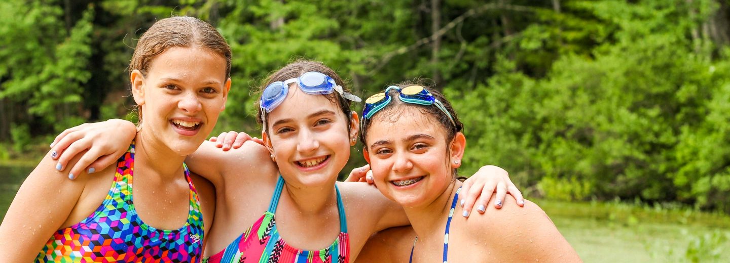 Girl campers in swimsuits