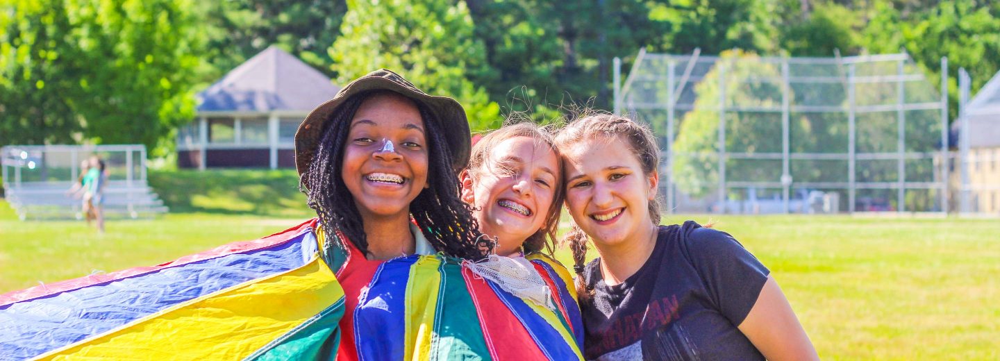 Girl campers with parachute