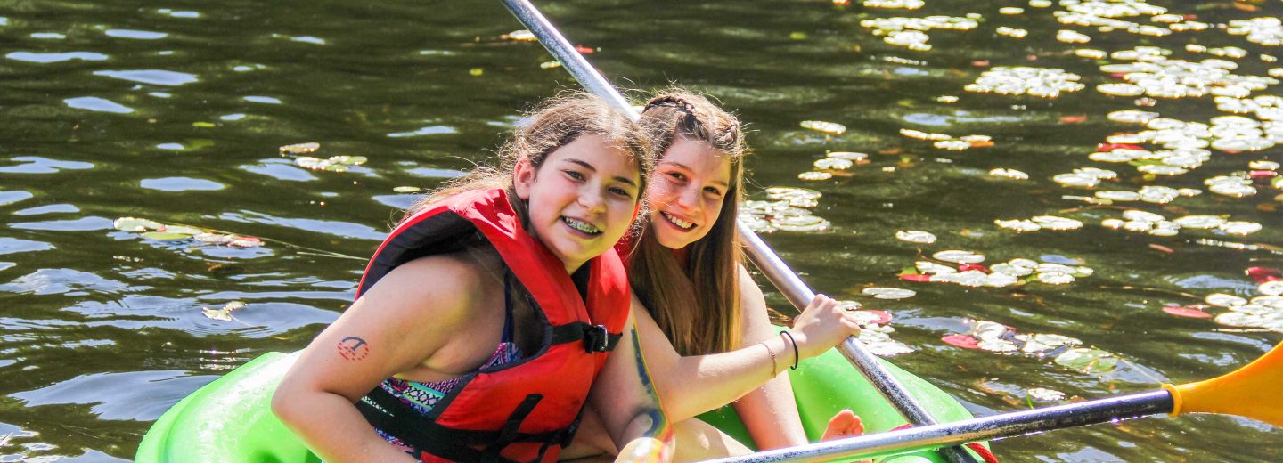 Girls in boat with oars